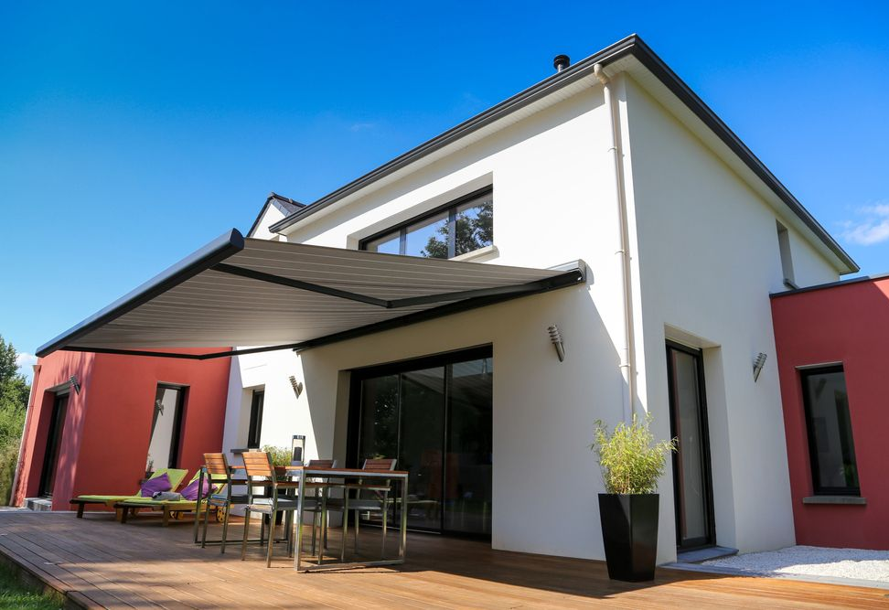 A modern white two-story house with red accents — Budget Screens & Awnings in South Lismore, NSW