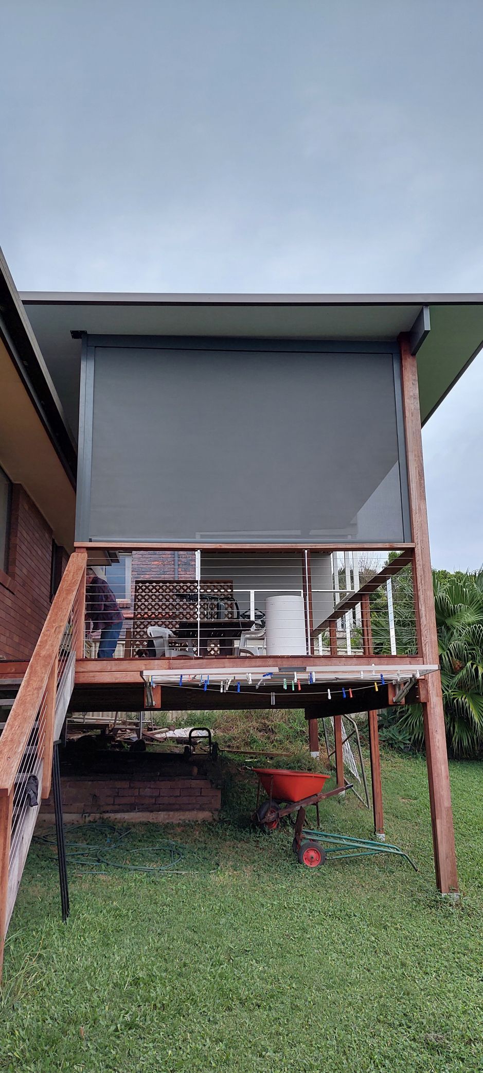 A wooden deck with a dark privacy shade — Budget Screens & Awnings in South Lismore, NSW