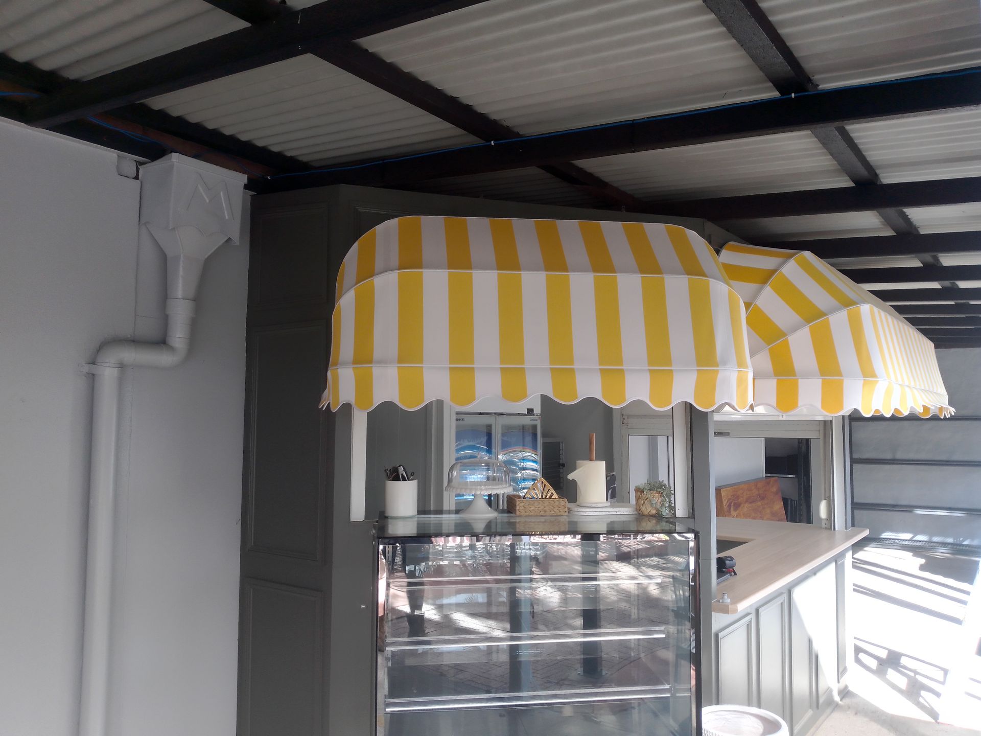 A food stall with an awning and a glass display case — Budget Screens & Awnings in South Lismore, NSW