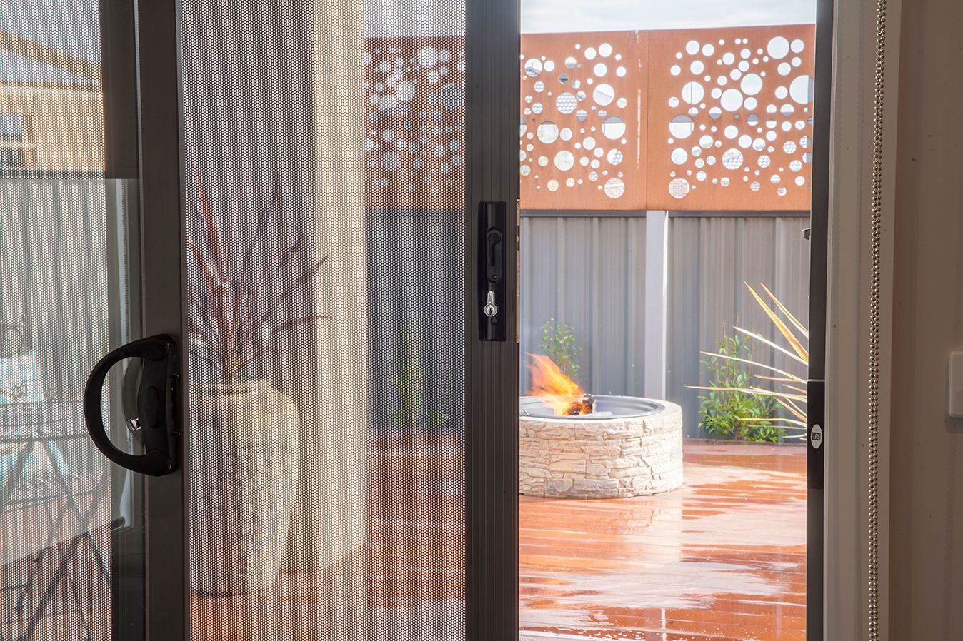 A sliding glass door with privacy screens — Budget Screens & Awnings in South Lismore, NSW