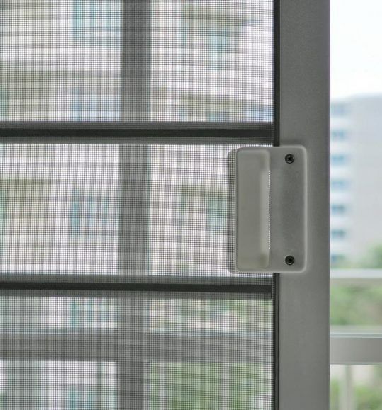 A Close Up of a Sliding Screen Door With a Handle — Budget Screens & Awnings in South Lismore, NSW