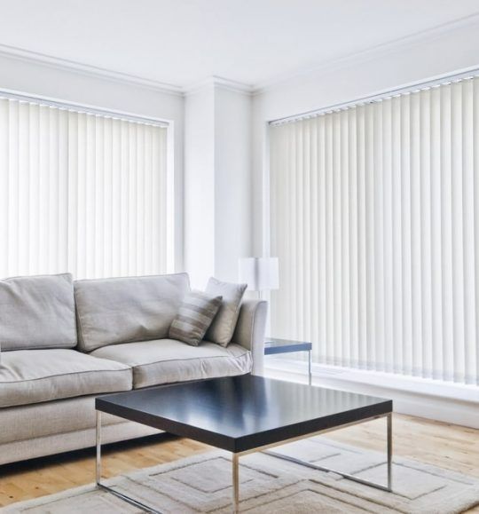 A Living Room With a Couch and a Coffee Table — Budget Screens & Awnings in South Lismore, NSW