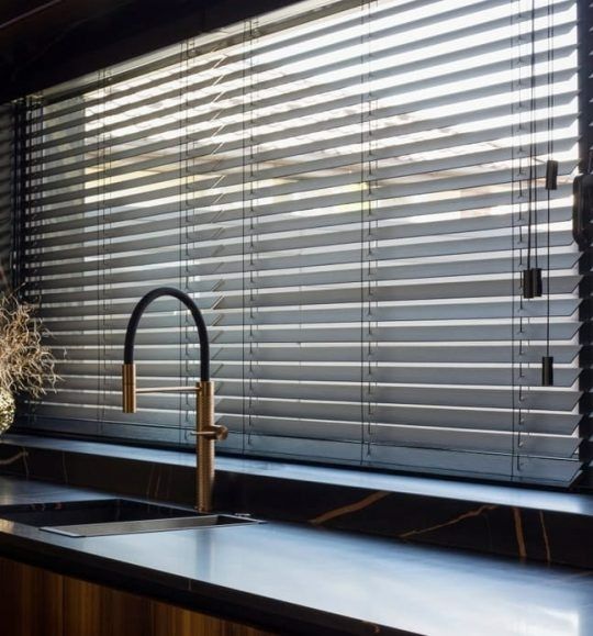 A Kitchen With a Sink and a Window With Blinds — Budget Screens & Awnings in South Lismore, NSW