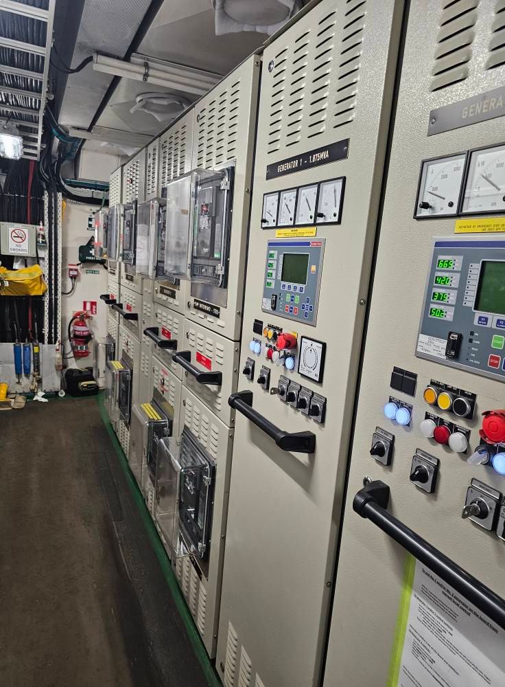 Two People Working on A Complex Machine — Projected Contracting Electrical Services In Weipa, QLD