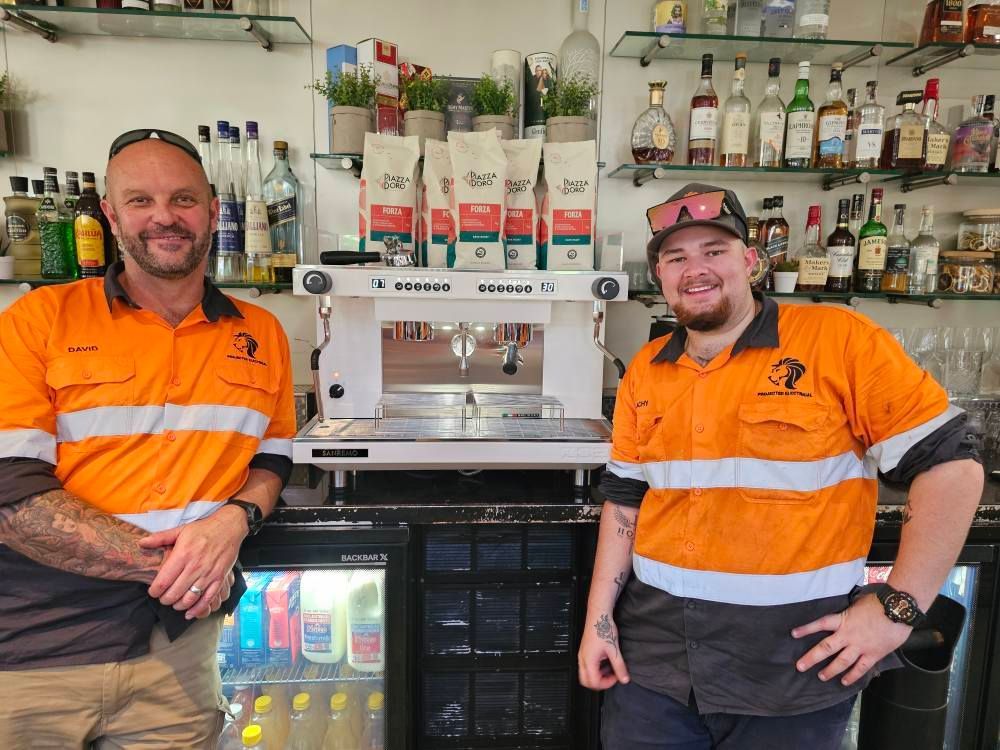 Barista Making Espresso in A Machine — Projected Contracting Electrical Services In Tablelands, QLD