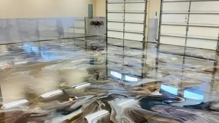 Flooded garage with reflective water on the floor and walls