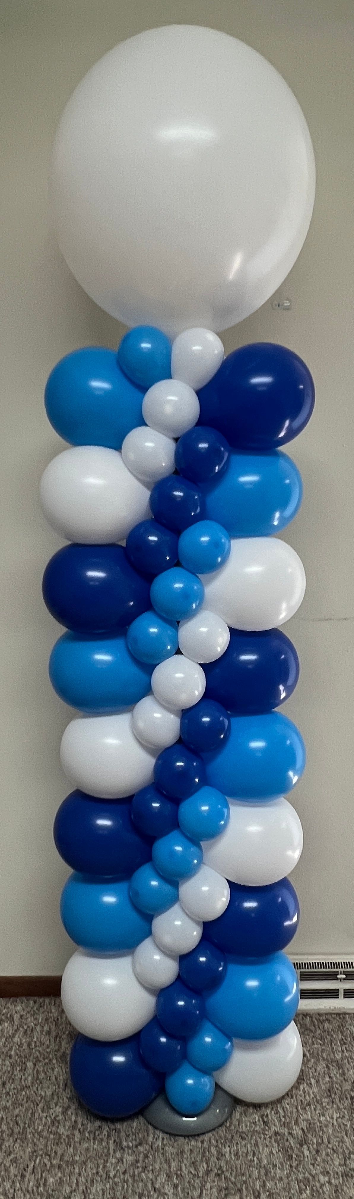 A column of blue and white balloons with a white balloon in the middle.