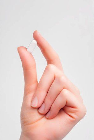 Women Holding Capsule — Medicine in Wilmington, DE Women Holding Capsule — Medicine in Wilmington, DE