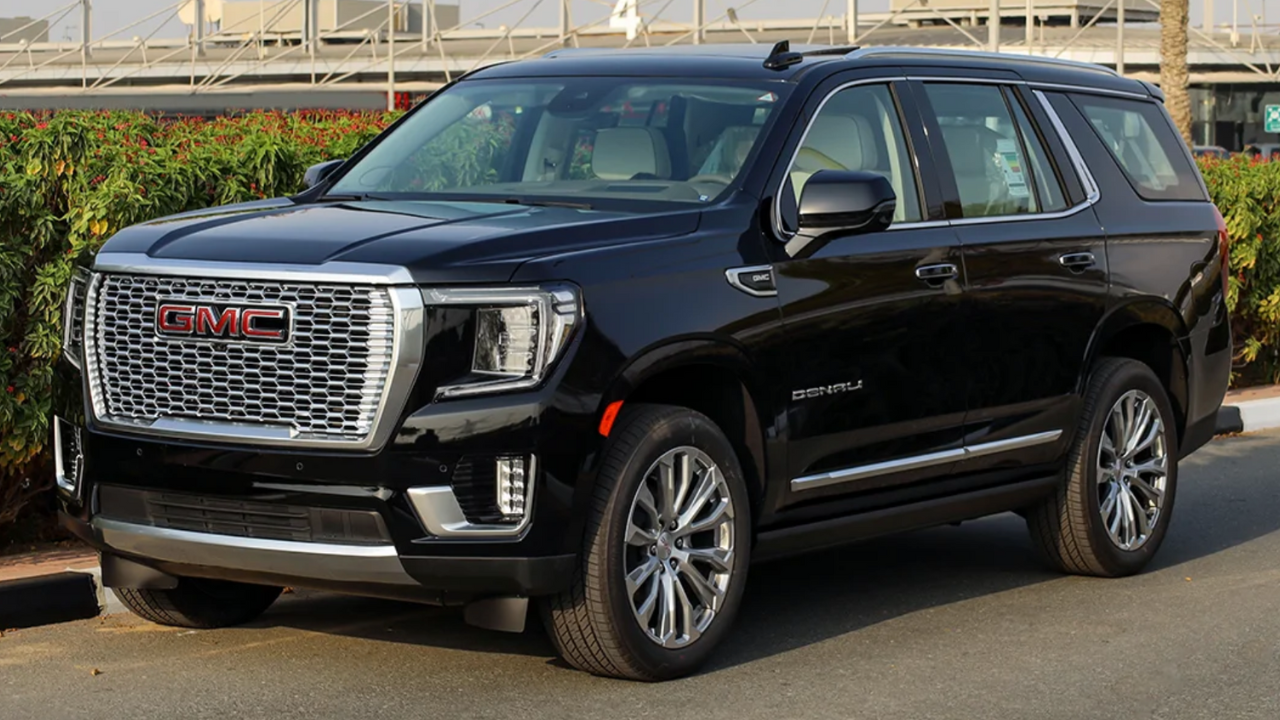 A black chevrolet suburban suv is shown on a white background.