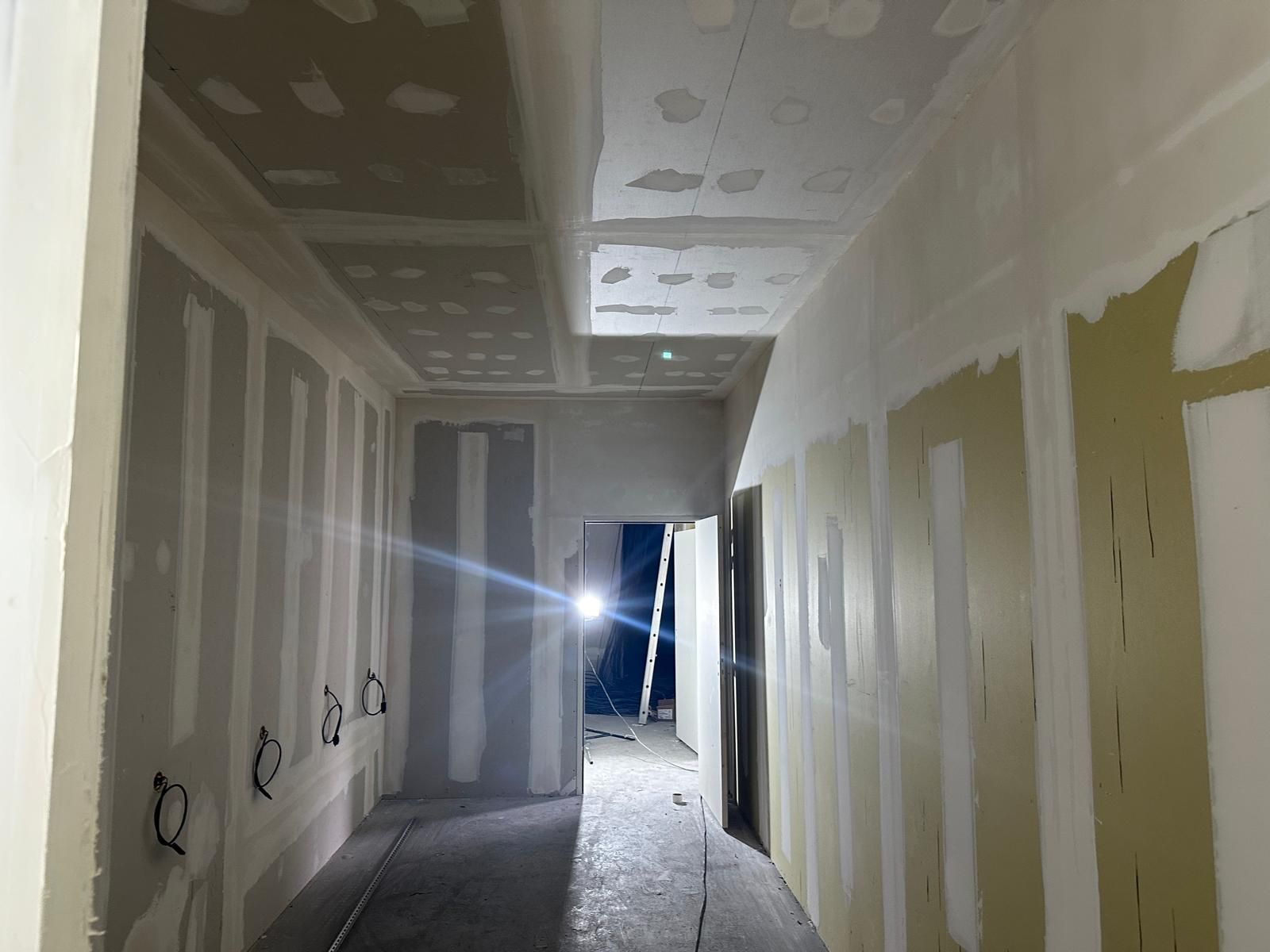 A long hallway with a ceiling that is being built