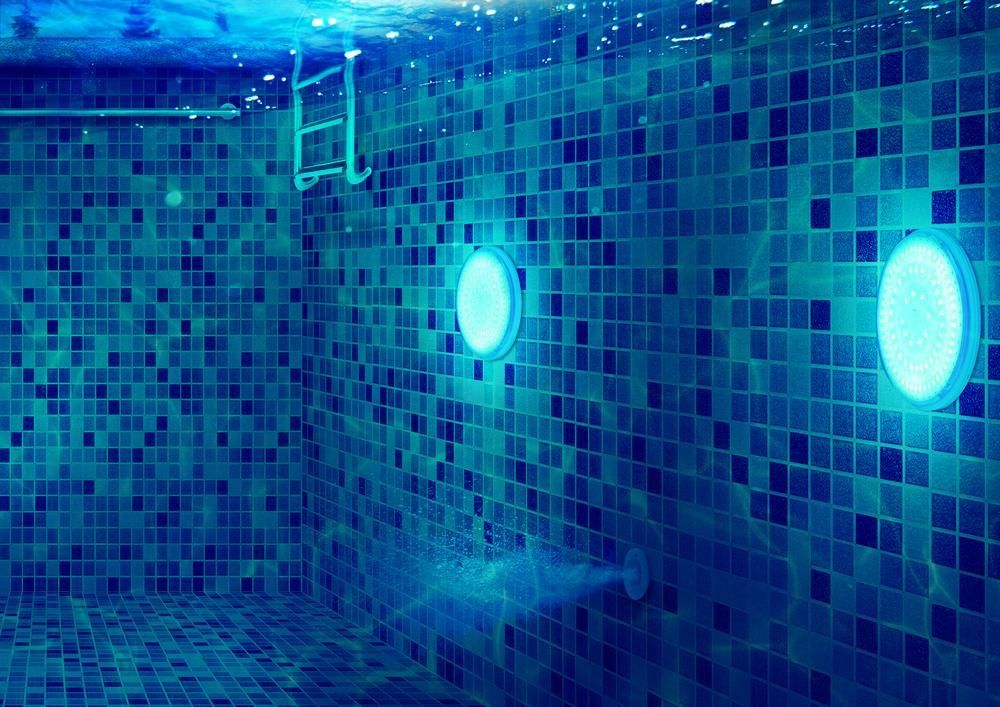 Swimming Pool with Blue Tiles and Lights Underwater — Beaches Pool Supplies in Kewarra Beach, QLD