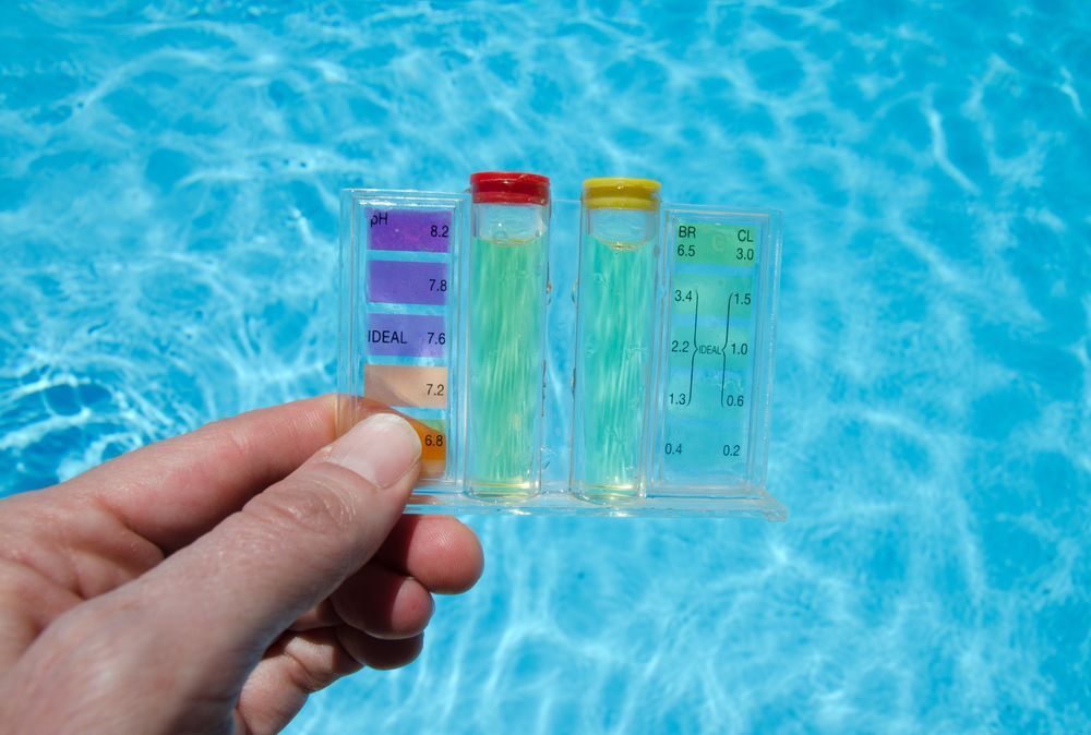 Person Holding Pool Water Testing Kit — Beaches Pool Supplies in Kewarra Beach, QLD