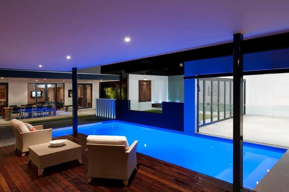 A large swimming pool in the middle of a house — Pool Equipment Installation in Kewarra Beach QLD