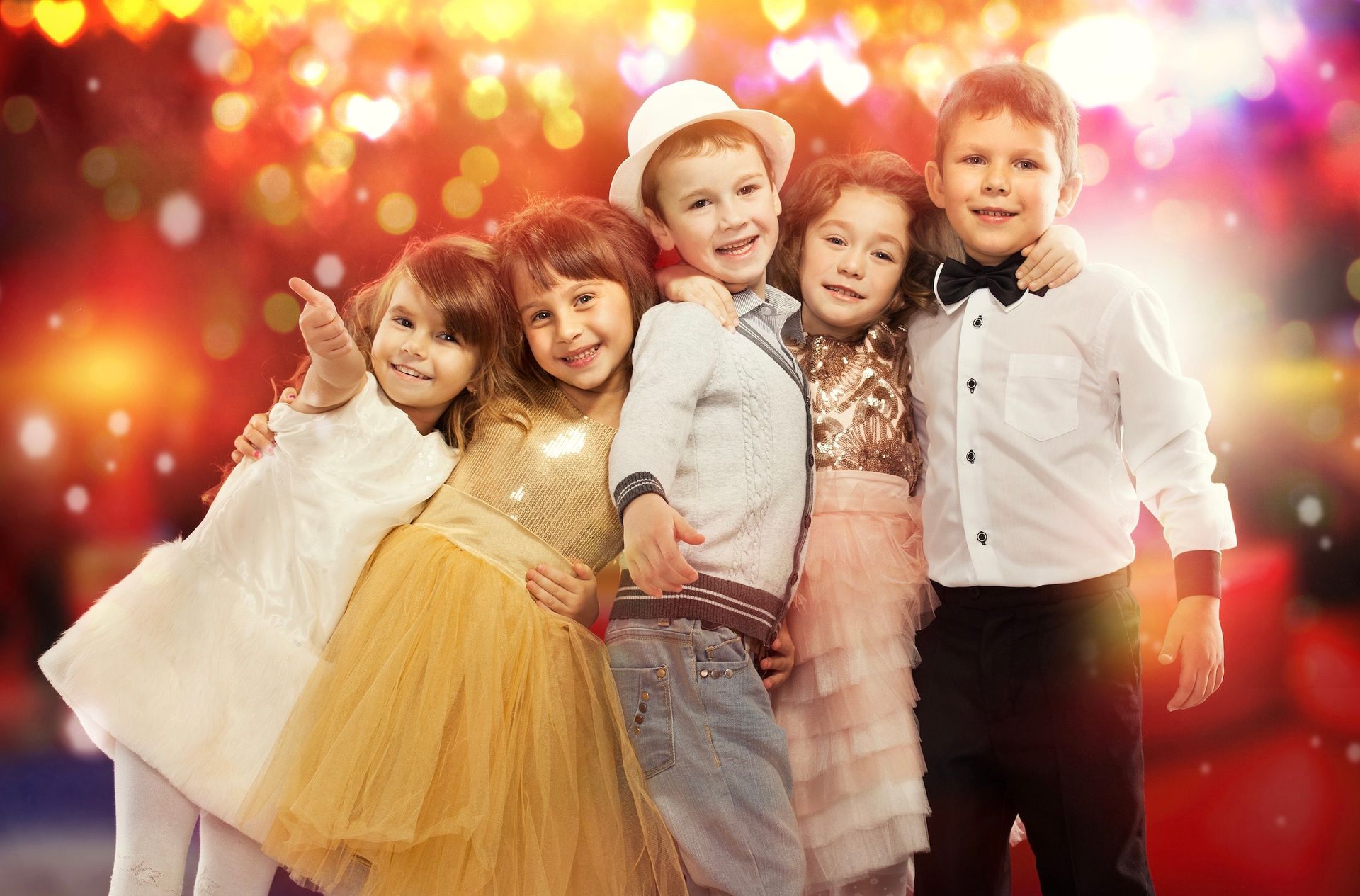 A group of children are posing for a picture together.