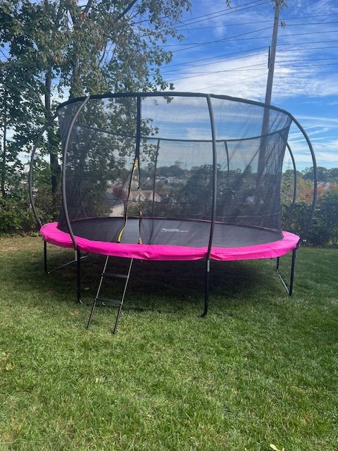 Backyard improvement project featuring a trampoline setup and outdoor yard update.