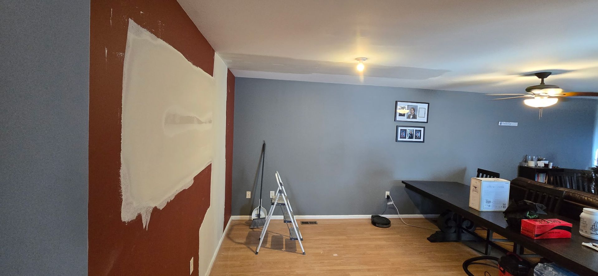Interior room repair showing fresh drywall patching and prep for wall painting during renovation.