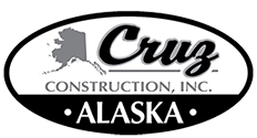 Logo for Cruz Construction, Inc., with the outline of Alaska and the word 
