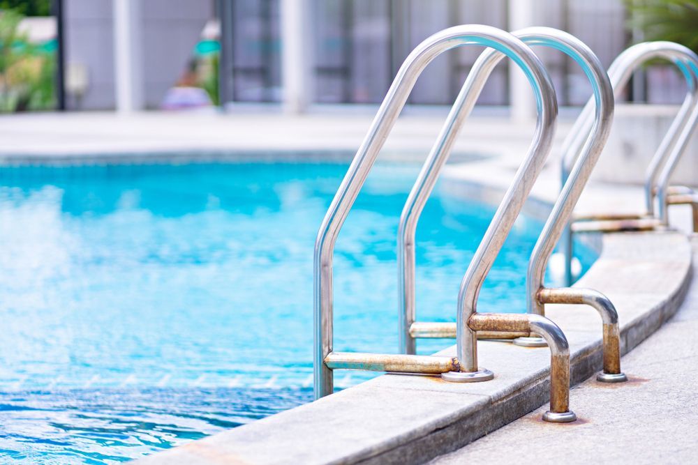 A Row Of Metal Stairs Leading To A Swimming Pool — Ballina Pool Shop In Alstonville, NSW