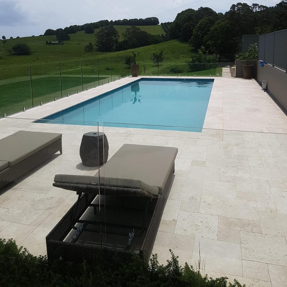 A Large Swimming Pool Is Surrounded By Lawn Chairs — Ballina Pool Shop In Ballina, NSW