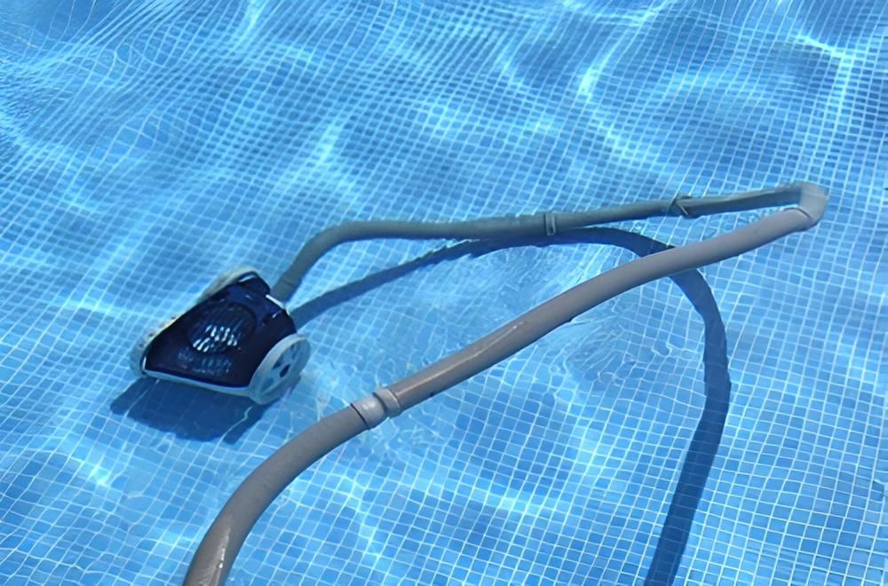 A Vacuum Cleaner Is Floating On Top Of A Swimming Pool — Ballina Pool Shop In Ballina, NSW