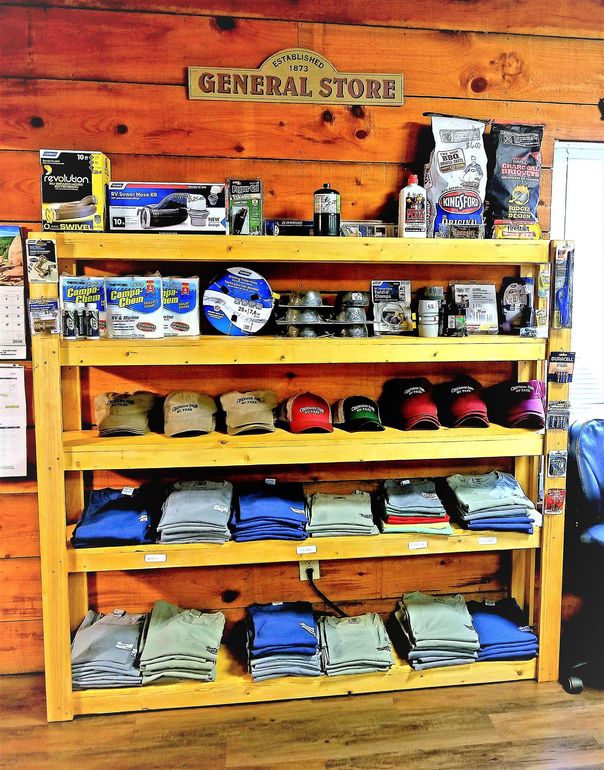 A wooden shelf with a sign above it that says general store