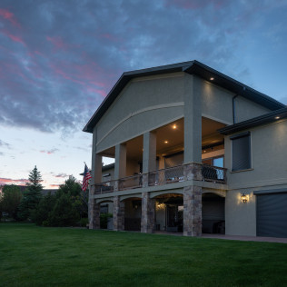 A large house with a large lawn in front of it