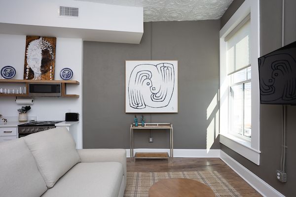 Living room with  bird art.