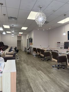 Modern salon interior with styling chairs, mirrors, and chandeliers