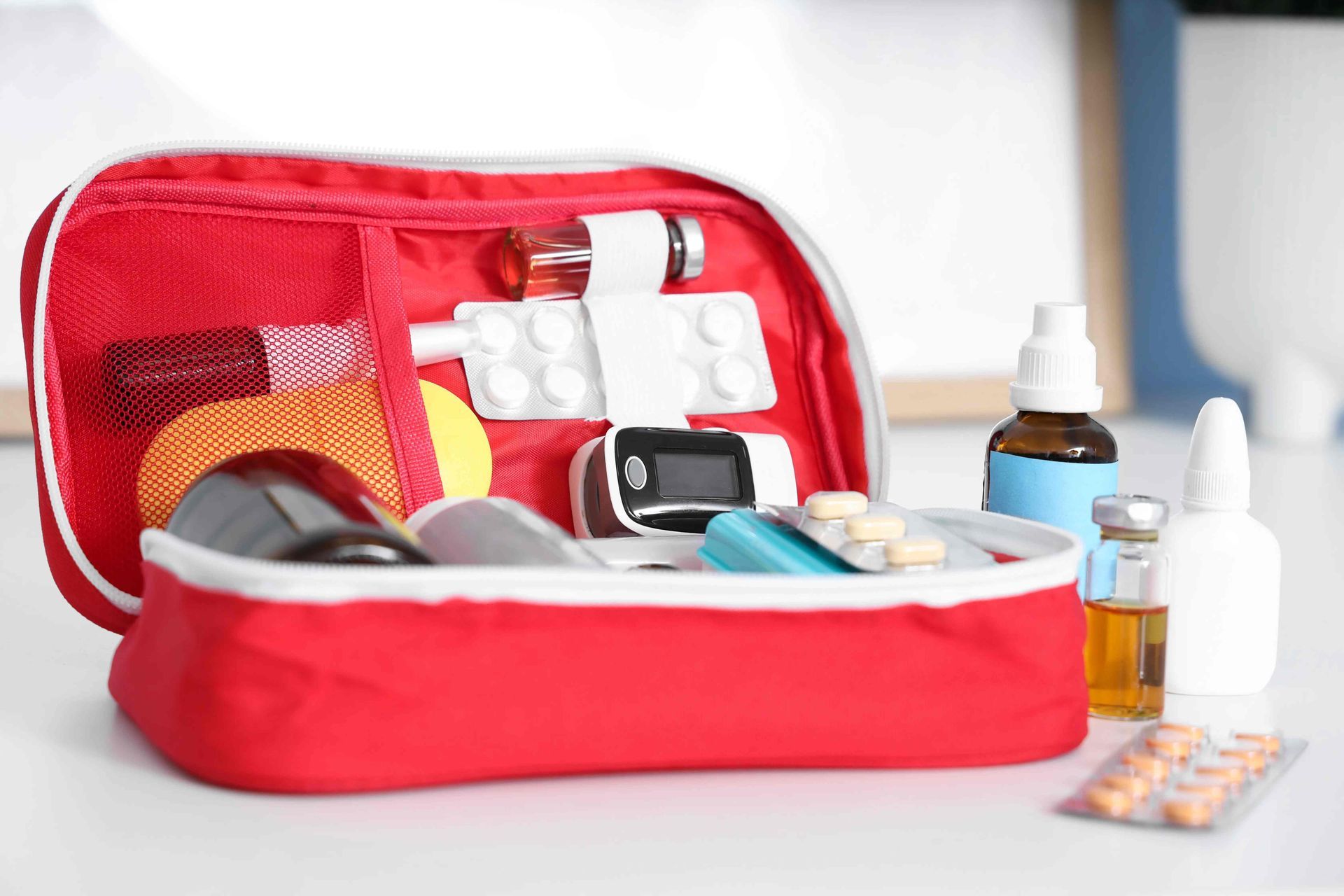 An open first-aid kit with a variety of necessary materials at The Ready Care Clinic near Harrodsbur