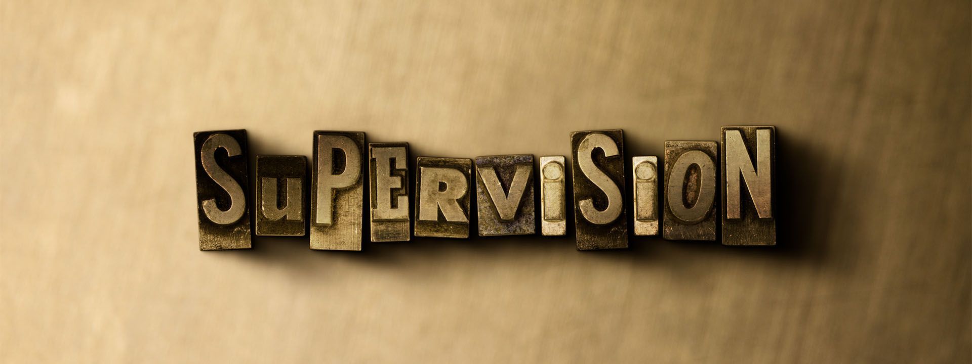 The word supervision is written in vintage letterpress type.