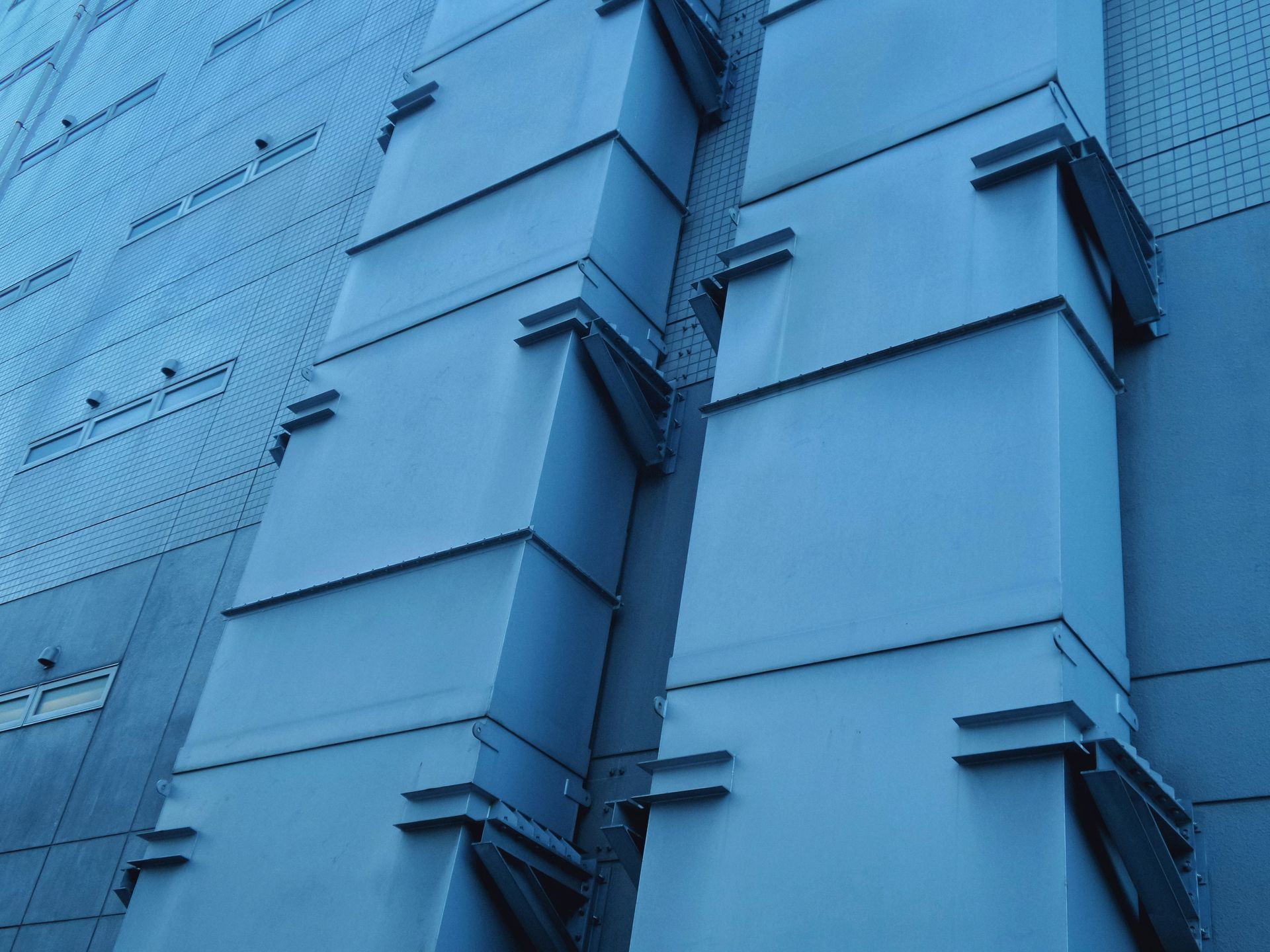 A building with a lot of blue boxes on it