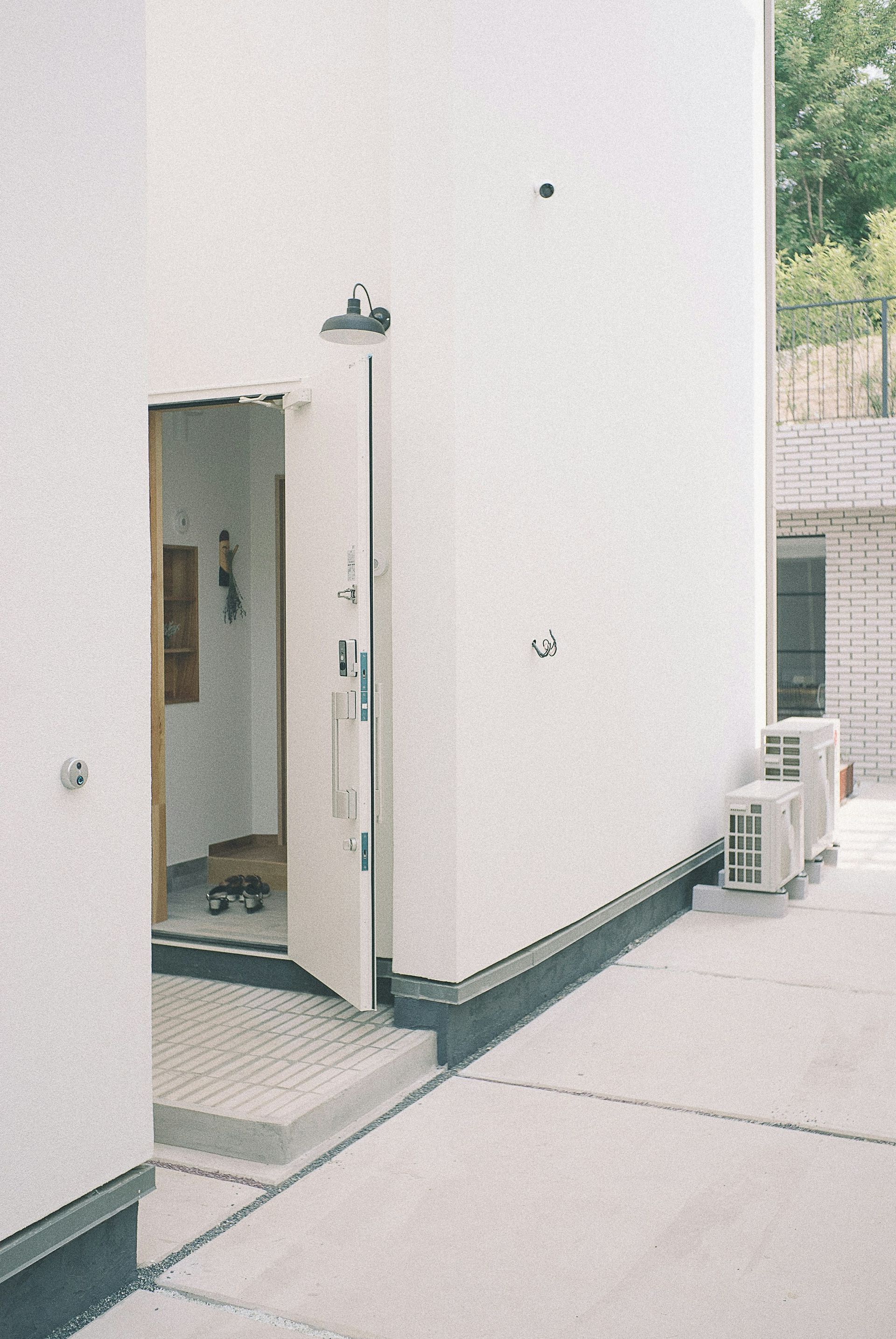 A white building with a door that is open