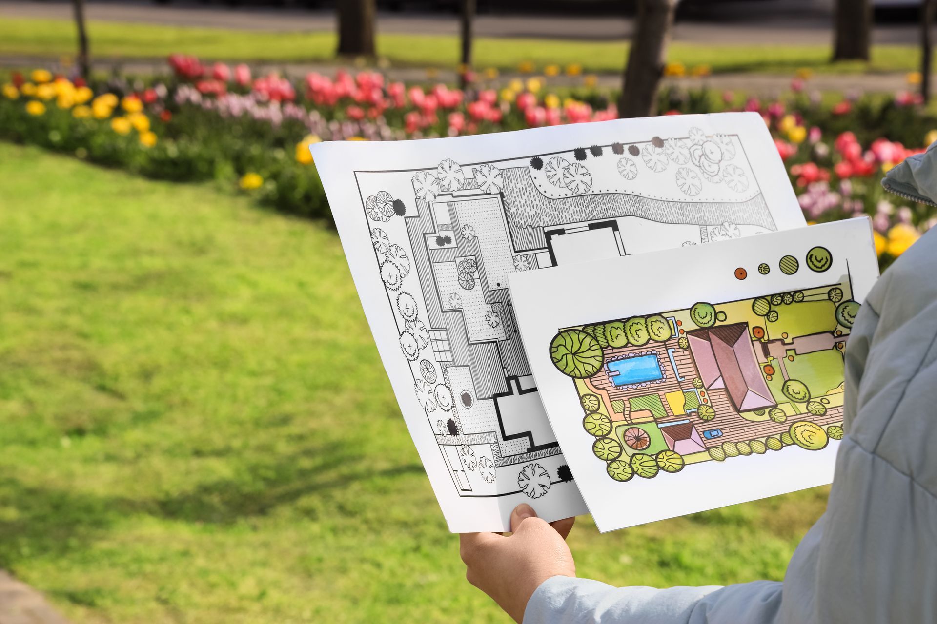 Female landscape designer with new projects in park, closeup Female landscape designer with new projects in park, closeup