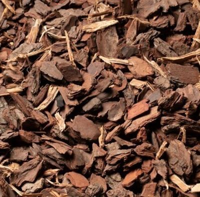 Brown wood chips mulch, close-up view.