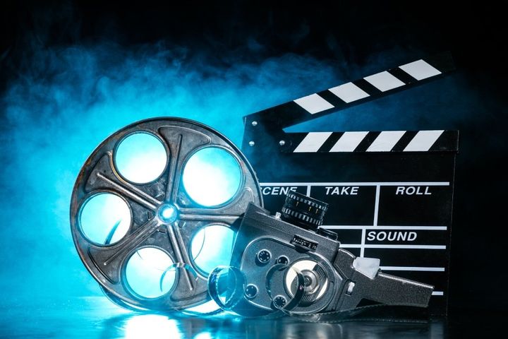 clapper and a movie reel