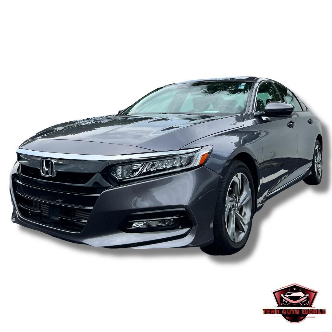 A dark gray Honda Accord sedan viewed from the front three-quarter angle against a plain white background.