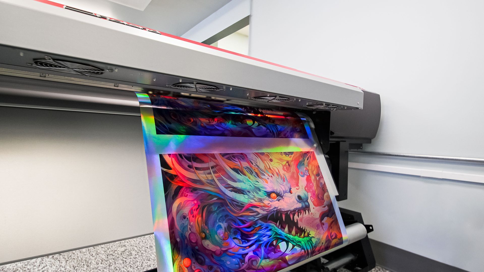 Large-format printer outputting a colorful abstract poster