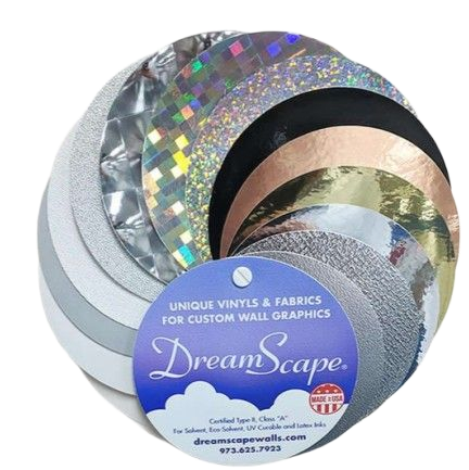 Rolls of shiny vinyl and fabric samples in assorted metallic colors, labeled DreamScape