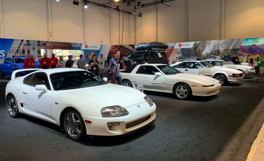 White Sports Cars Displayed At Indoor Auto Show | Neil's Motors Inc