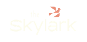 Pale yellow “the skylark” text on a white background
