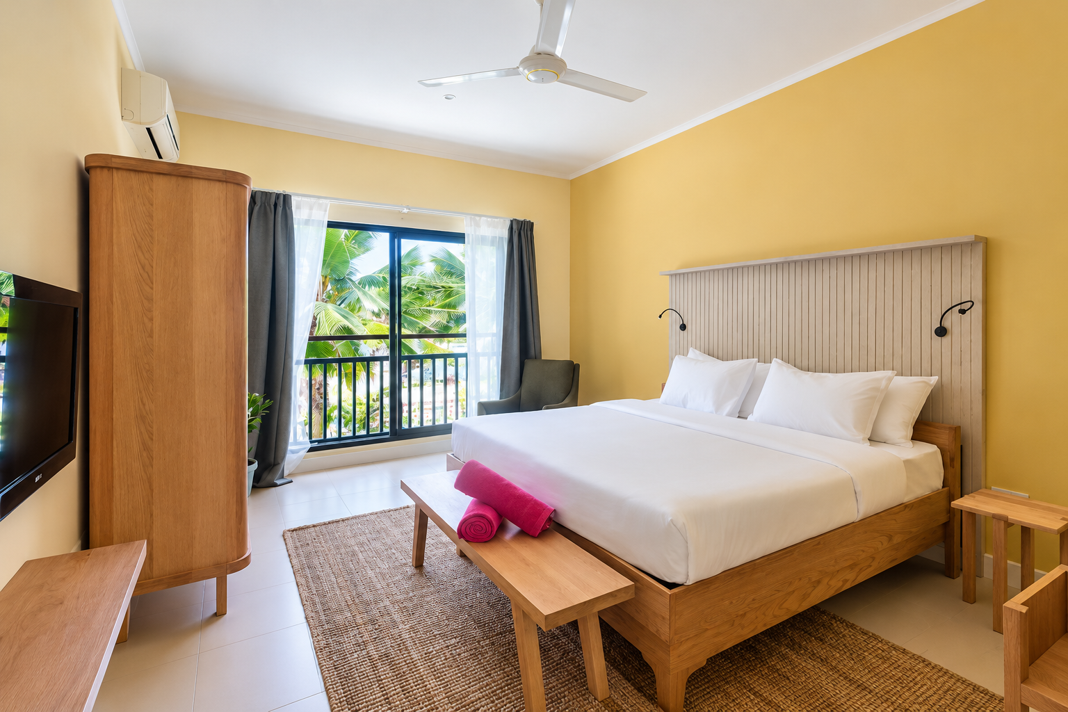 Small bedroom with olive chair, bed, yellow walls, window with curtains, and framed wall art.