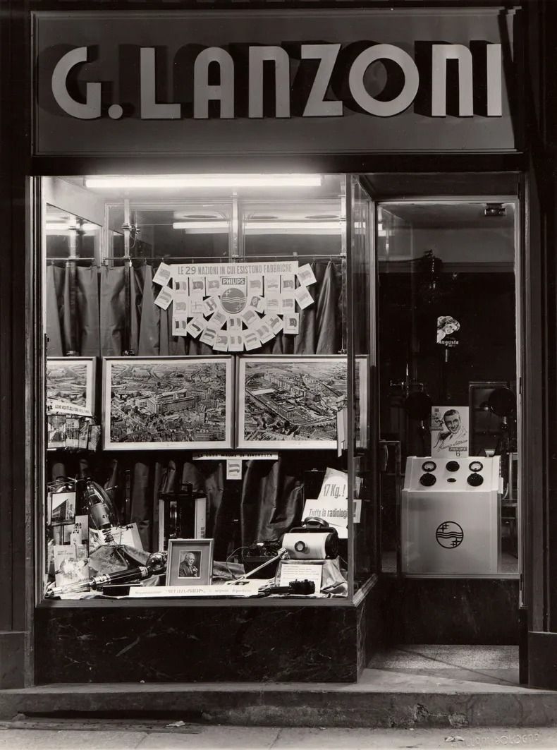 A black and white photo of a store called g. lanzoni