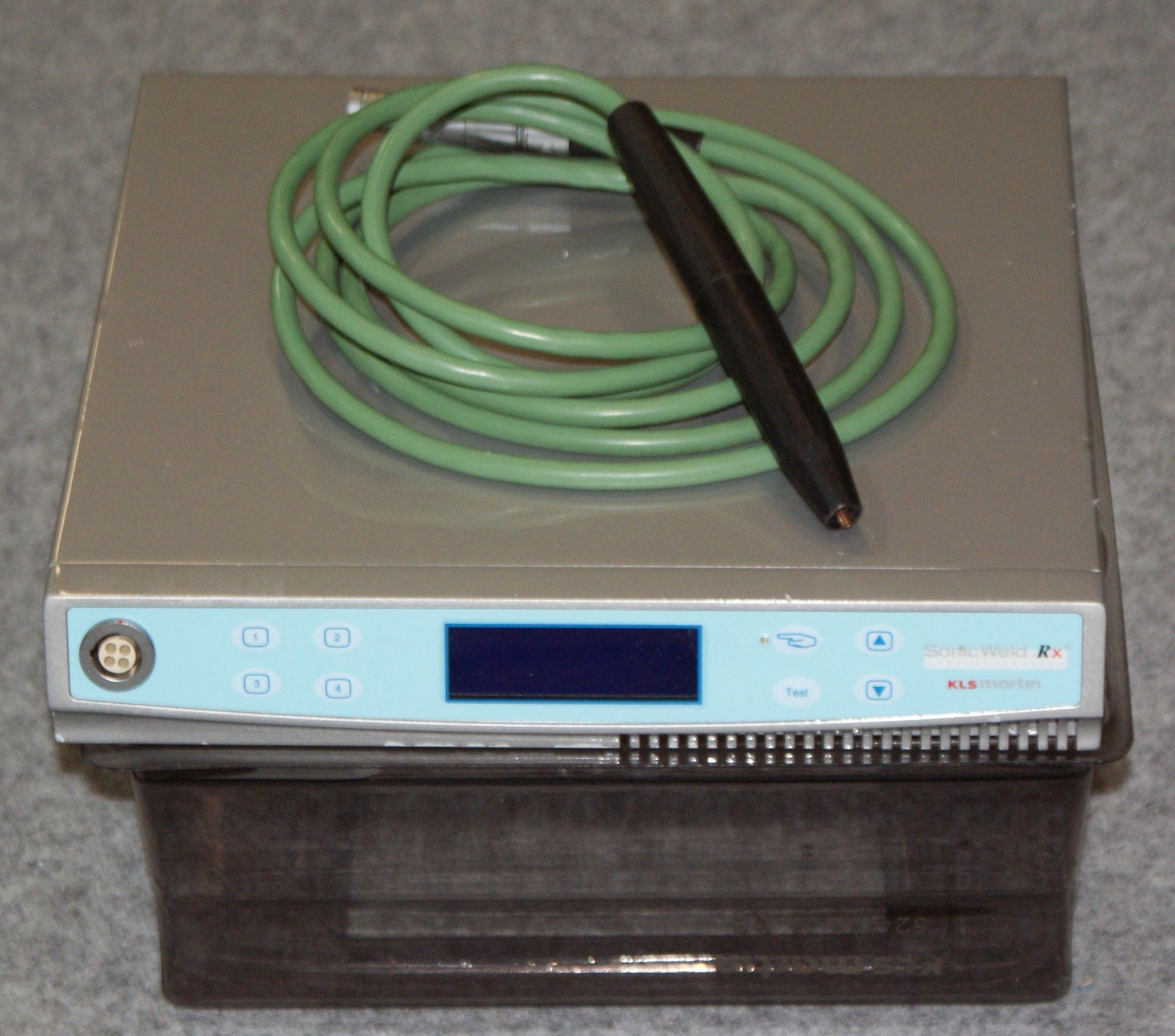 A device with a green cord attached to it