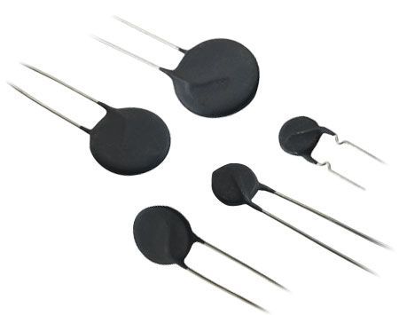 Five black round thermistors with silver leads, varying in size.