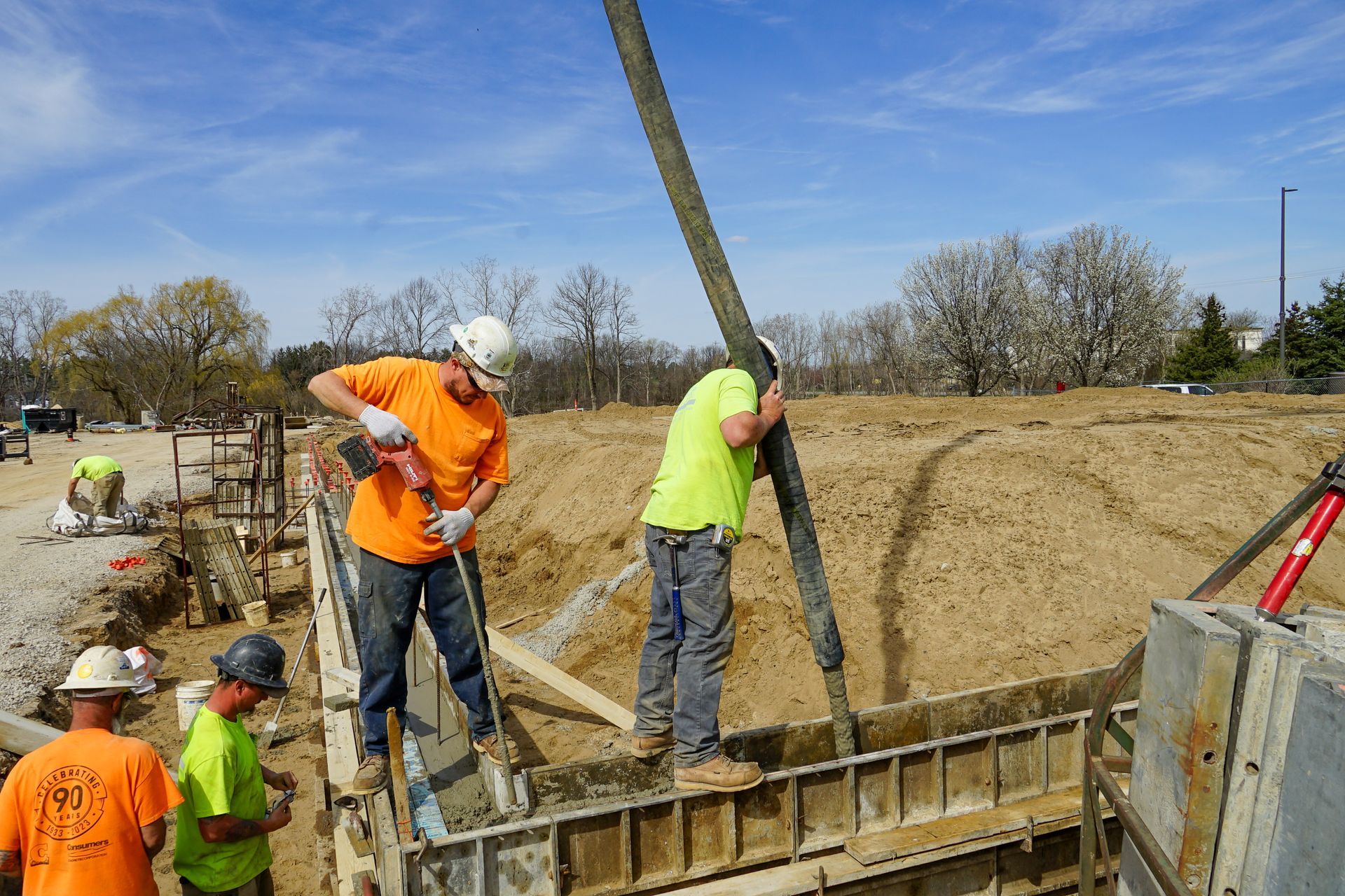 A group of construction workers are working on a construction site.