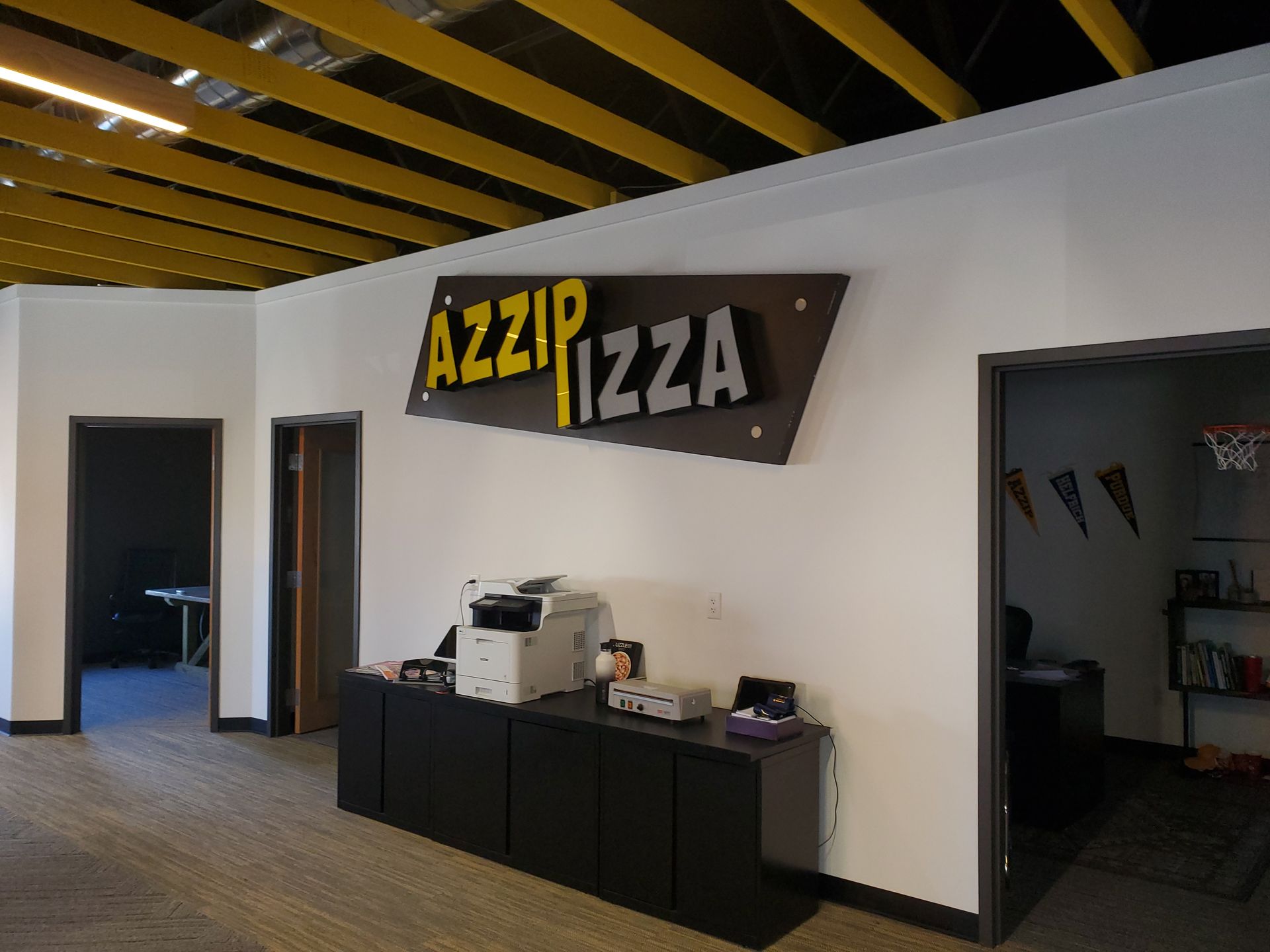 Sign that says Azzip Pizza