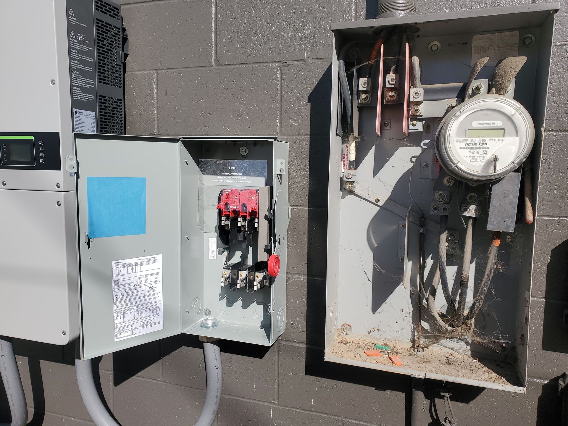 A open power box revealing the net metering and wiring