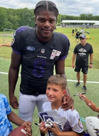 children with Ravens quarterback Lamar Jackson