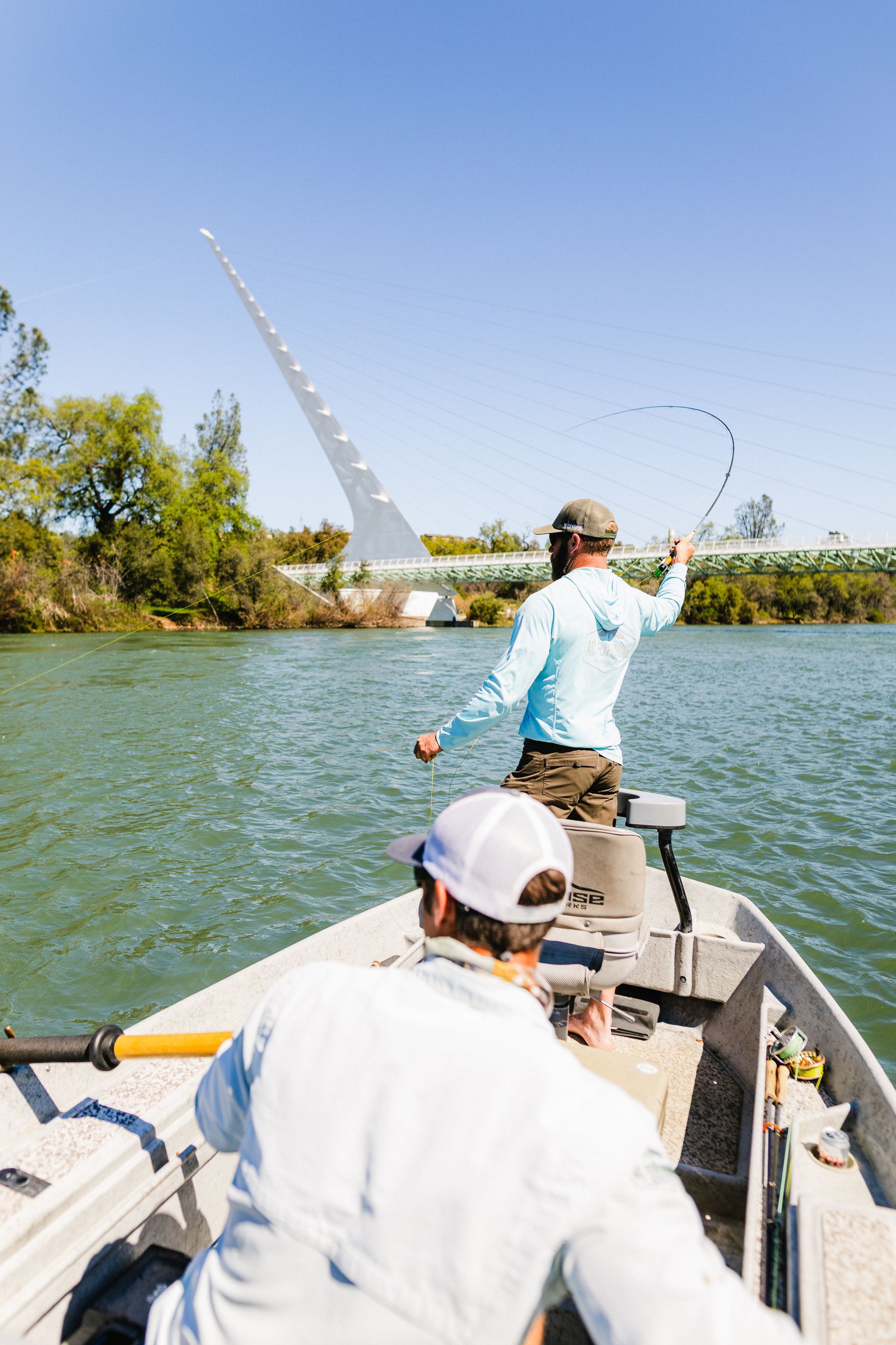 lower-sacramento-river-guided-fly-fishing Angler fly fishing on California’s Lower Sacramento River with a professional guide