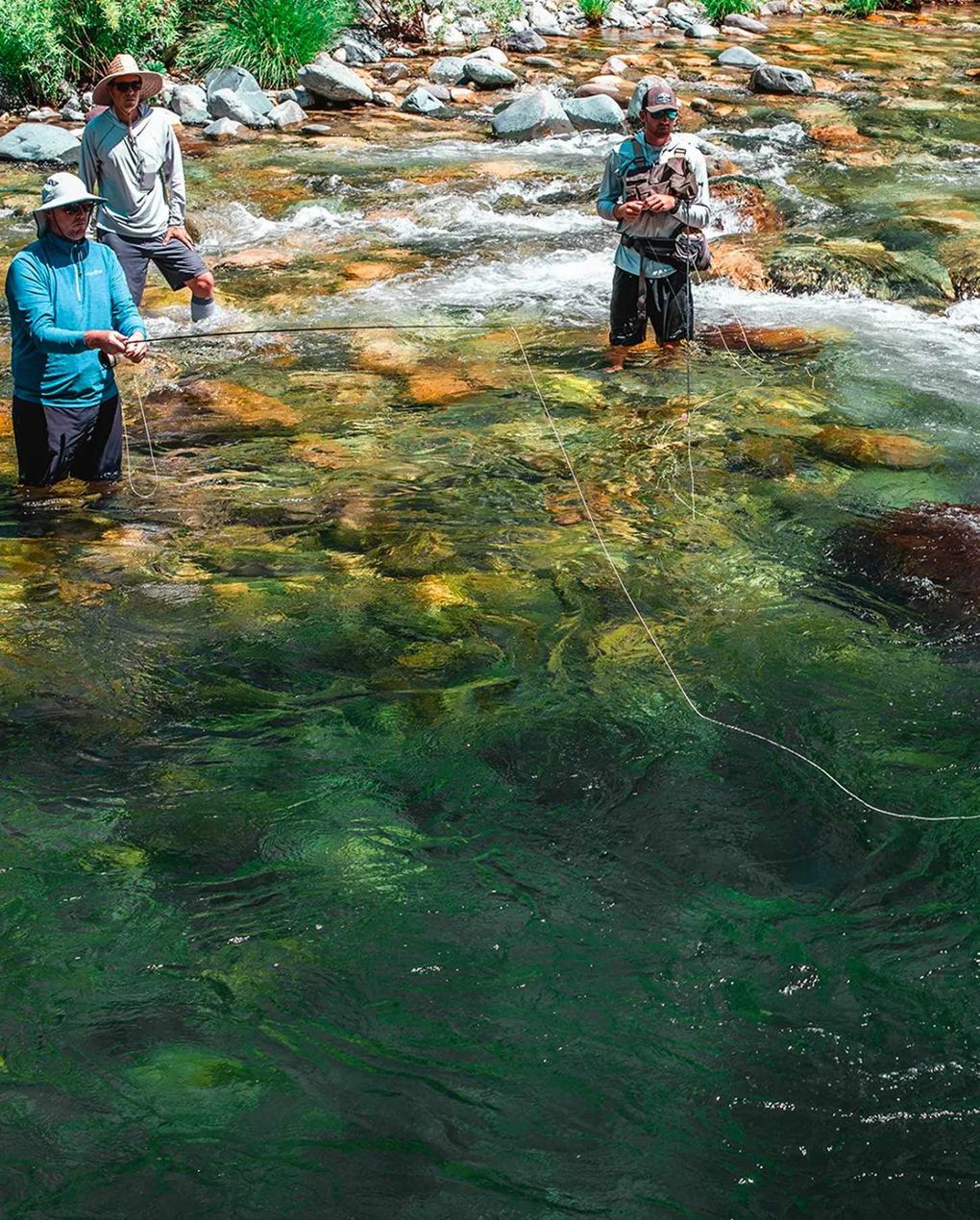 Guide with anglers on a fly fishing trip in Redding California. 